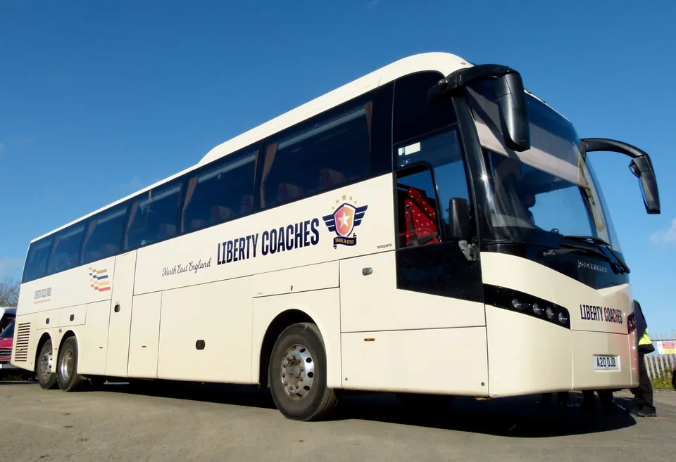 Cream Liberty Coaches coach viewed from the front and side